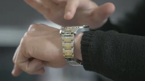 Man uses his smart watch Stock Footage 63353683