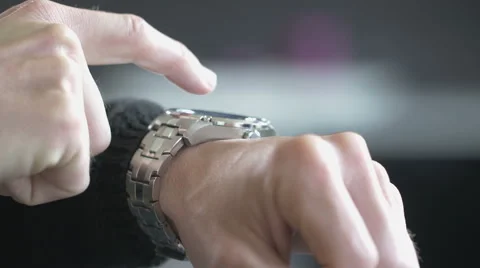 Man uses his smart watch Stock Footage 63353687