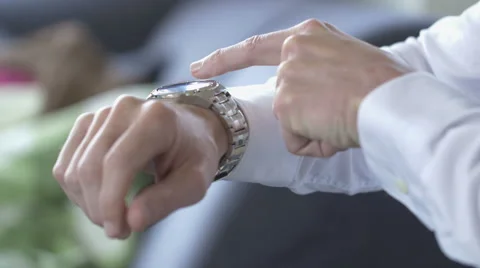 Man uses his smart watch Stock Footage 63354336