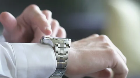 Man uses his smart watch Stock Footage 63354375