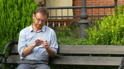 Man Uses His Smartphone to Connect to Internet Stock Footage 67538570