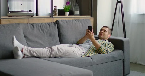 Man uses his smartphone Stock Footage 112762584