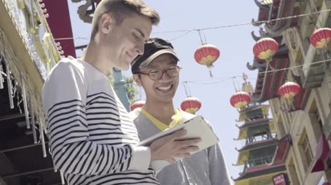 Man Uses His Tablet, His Boyfriend Asks Him To Take A Picture Of Him(4K) Stock Footage 50276959
