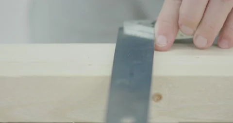 Man uses iron ruler angle bar to mark wooden plank size, DIY or do it yourself 스톡 동영상 135193094