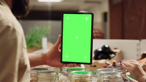 Man uses isolated screen tablet in shop Stock Footage 254038319