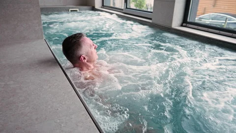 A man uses a jacuzzi. Stock Footage 311244650