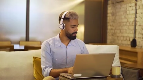 Man uses laptop and types on the keyboard Stock Footage 146376599