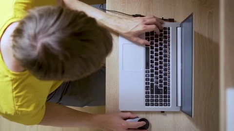 A man uses a laptop for distant work on a project. Work from home concept Stock Footage 157724220