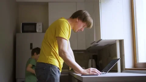 A man uses a laptop for distant work on a project. Work from home concept Stock Footage 157731608