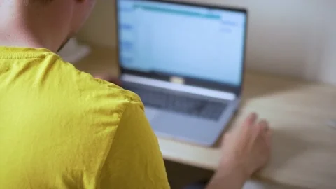 A man uses a laptop for distant work on a project. Work from home concept Stock Footage 158549328