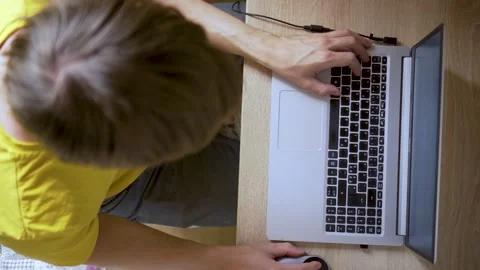 A man uses a laptop for distant work on a project. Work from home concept Stock Footage 163332713
