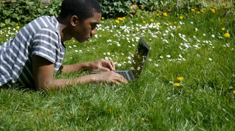 Man uses laptop outside Stock Footage 37170929
