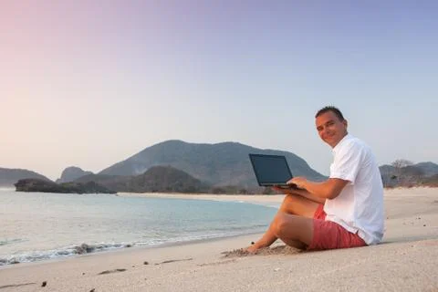 Man uses laptop remotely Stock Photos