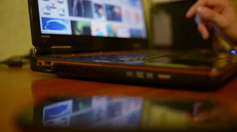 Man uses a laptop on the table Stock Footage 68745944