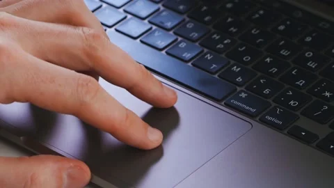 A man uses a laptop touchpad Stock-Footage 176889298
