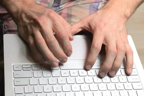 Man uses laptop while sitting at home. Online shopping concept, online games Stock Photos