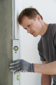 Man uses the level Stock Photos