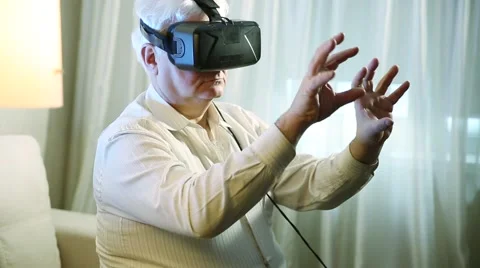 A man uses a mask with display virtual reality Stock Footage 60576163