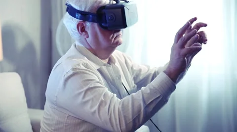 A man uses a mask with display virtual reality Stock Footage 60576384