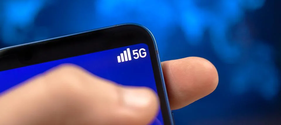Man uses mobile phone with 5G network wireless system. Banner, concept of hig Stock Photos