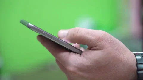 Man uses a mobile phone Stock Footage 136481085