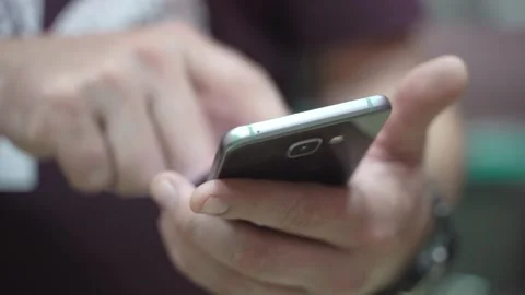 Man uses a mobile phone Stock Footage 136481101