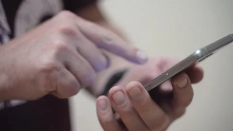 Man uses a mobile phone Stock Footage 136481173
