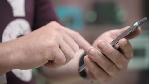 Man uses a mobile phone Stock Footage 136481177