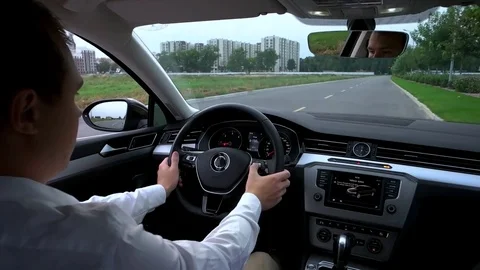 The man uses the multifunction in the car Stock Footage 80430146