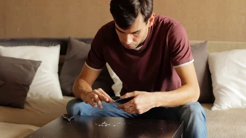 Man uses nail clipper cut the nails, short for good hygiene. cut off fingernails Stock Footage 81730567