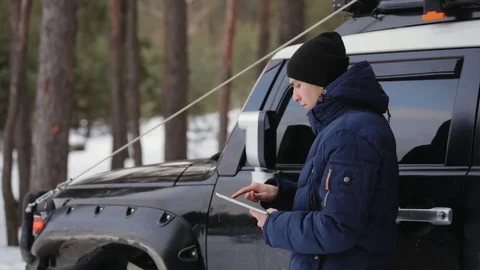 Man Uses Navigation. Winter Day Stock Footage 73425924