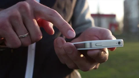 Man Uses The ohone At a Sunset Background Stock-Footage 64874066