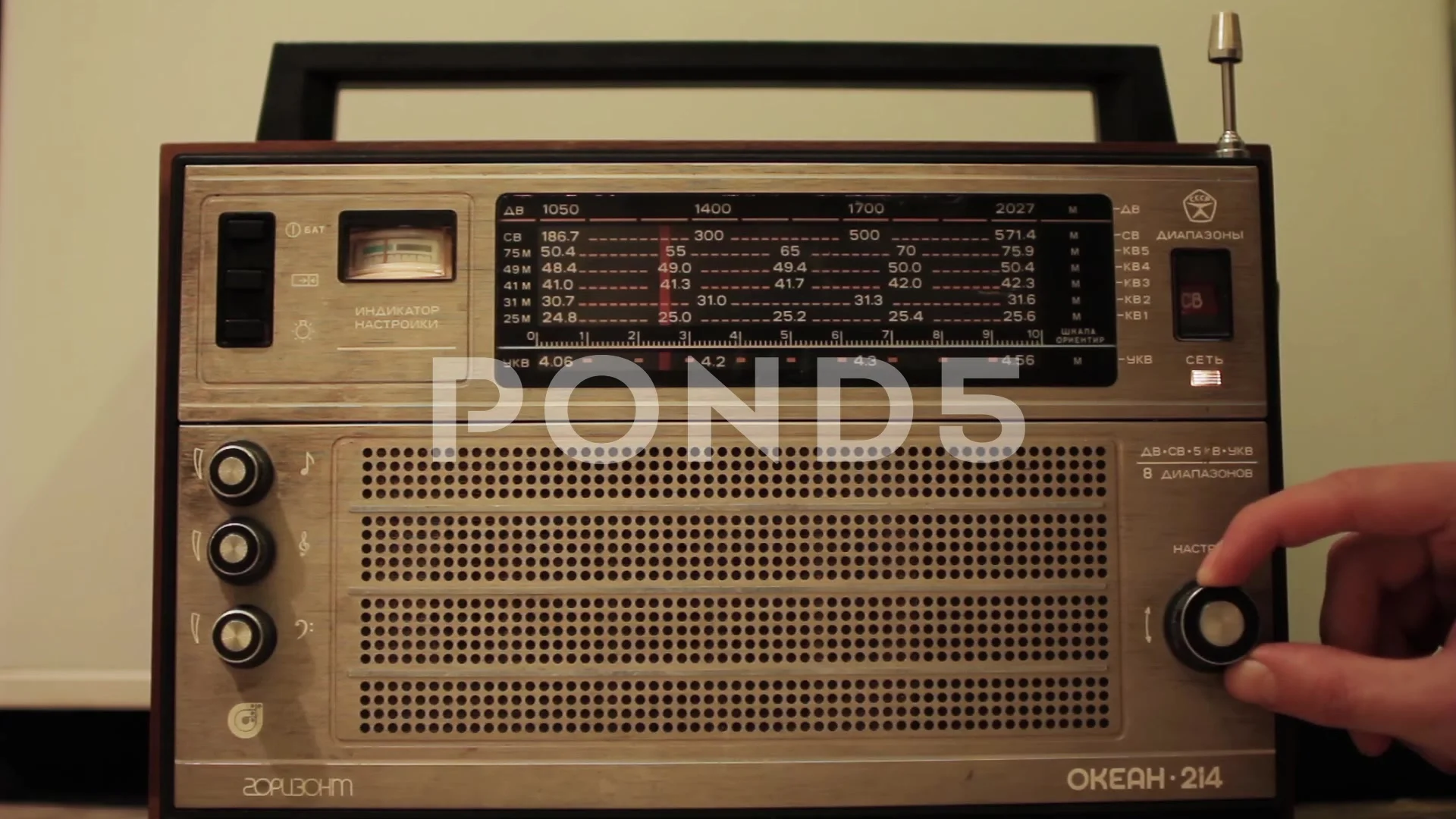 A man uses an old radio, Searching Radio... | Stock Video | Pond5