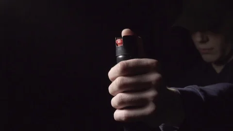 Man uses pepper spray for self-defense Stock Footage 121481883