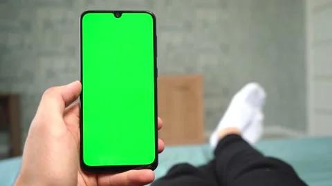 Man uses the phone while lying on the bed Vídeo Stock 140650183