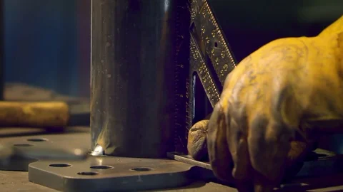 Man Uses Rafter's Square To Align Metal Base Stock Footage 78577085