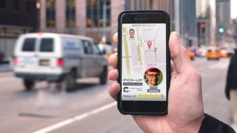 Man Uses Ride Sharing App on Phone to Call Driver Stock Footage 71745783