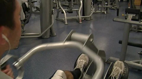 Man Uses Rowing Machine Stock Footage 7728204