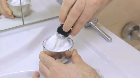 Man uses shaving accessories for preparing shaving foam Stock Footage 128882018