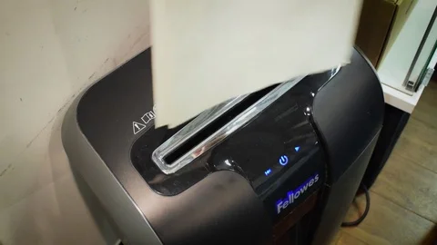 Man uses the shredder Stock Footage 71042328