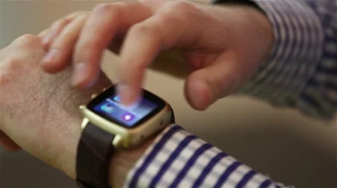 A man uses a smart watch on his arm. Stock Footage 48596326