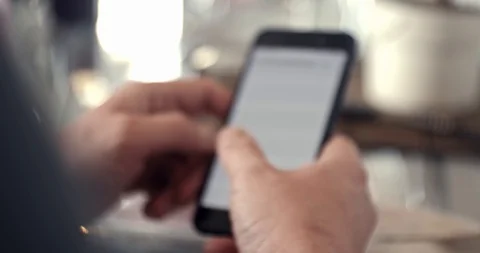 A man uses a smartphone bokeh Stock Footage 106255800