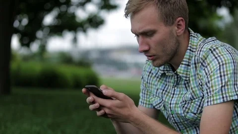Man uses a smartphone Stock Footage 70681455