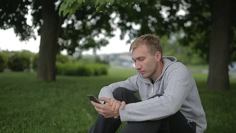 Man uses a smartphone Stock Footage 70681492