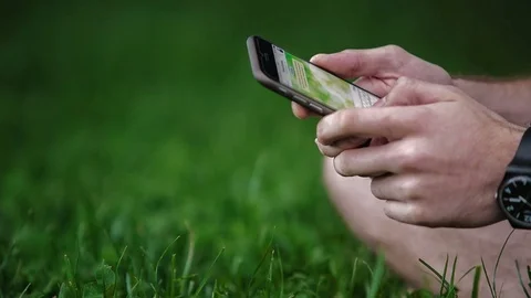 Man uses a smartphone Stock Footage 70681569
