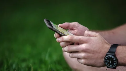 Man uses a smartphone Stock Footage 70682305