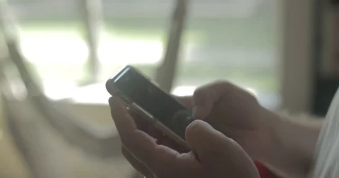 Man uses smartphone at home 库存影片 78037909