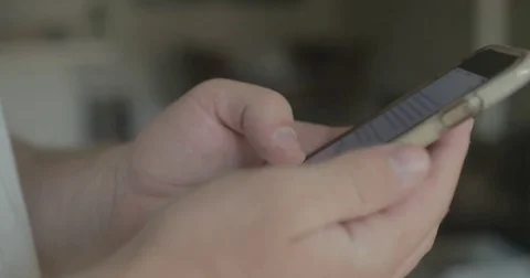 Man uses smartphone at home Video stock 78038033