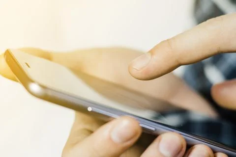 A man uses a smartphone. Foto stock