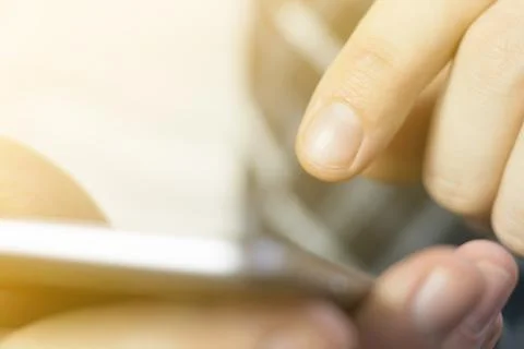 A man uses a smartphone. 库存照片